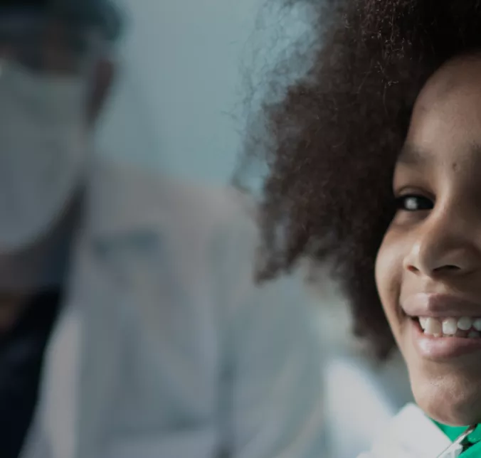Banner Unimed Odonto Essencial Exclusivo Menina sorrindo no dentista